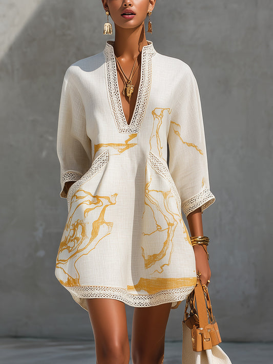 Aliénor | Robe mini ivoire en dentelle crochetée à motifs dorés et décolleté en V