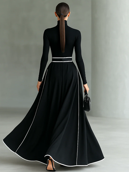 LEANDRA | Robe longue à col montant, bordures contrastées et ceinture